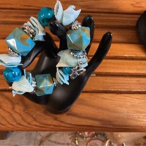 BRACLET WITH CHARMS, SHELLS, BEADS WITH TURQUOISE BLUE HIGHLIGHTSFUN & UNUSUAL